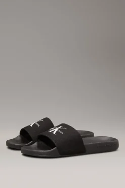 Calvin Klein Sandalias slides con logo grabado.