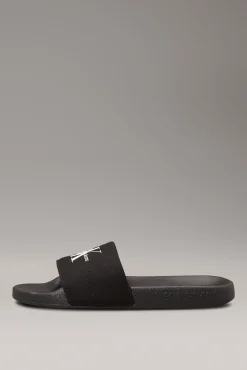 Calvin Klein Sandalias slides con logo grabado.